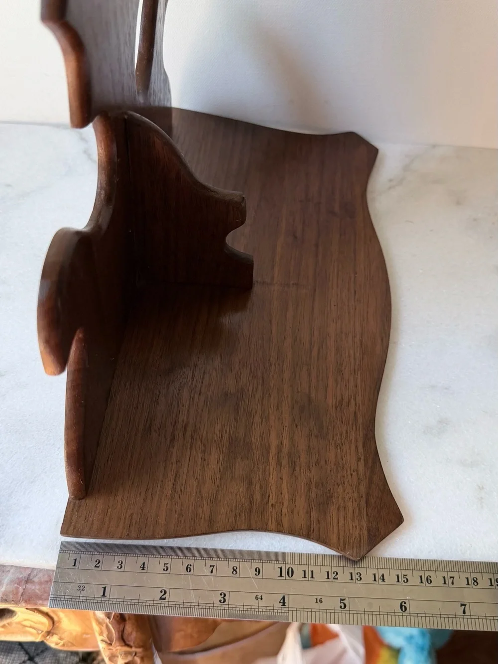 vintage wall sconce shelf made of carved wood with a dark finish